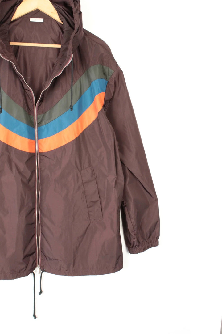 Dries Van Noten brown windbreaker jacket with multi-coloured chevron stripes and silver zipper.
