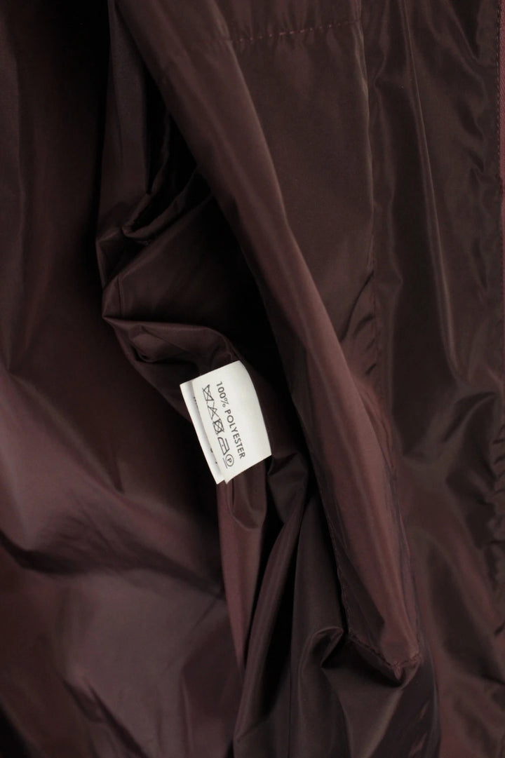 Dries Van Noten brown windbreaker jacket with multi-coloured chevron stripes and silver zipper.