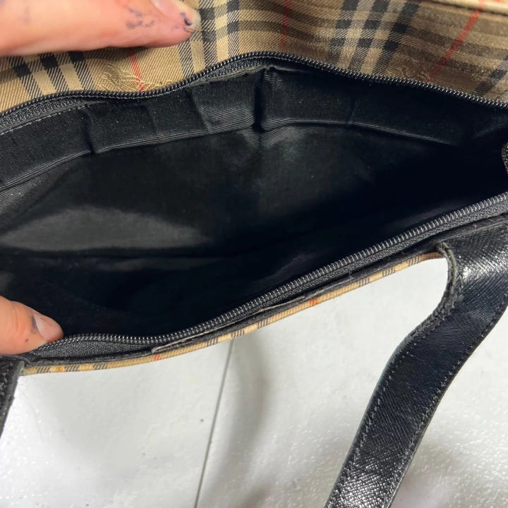 Burberry beige Nova Check tote bag with black leather base and shoulder straps.