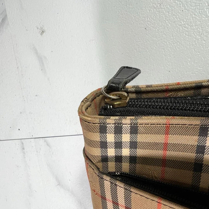 Burberry beige Nova Check tote bag with black leather base and shoulder straps.