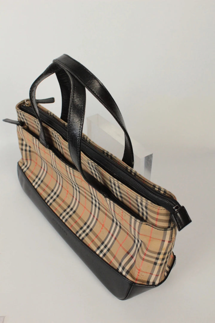 Burberry beige Nova Check tote bag with black leather base and shoulder straps.