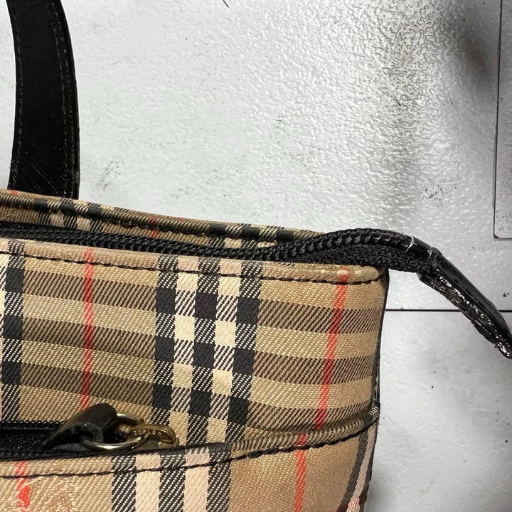 Burberry beige Nova Check tote bag with black leather base and shoulder straps.