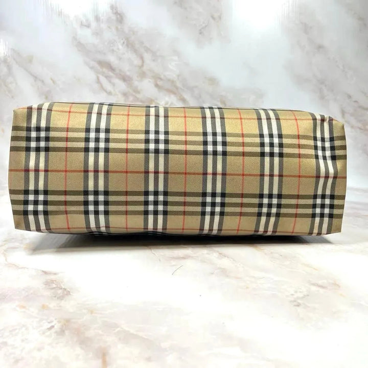 Burberry beige and black large shopper tote with iconic Nova Check pattern and leather trim.