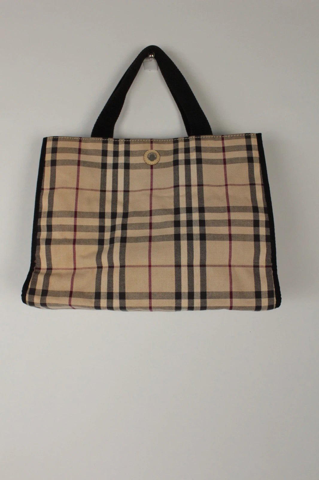 Burberry beige Nova Check tote bag with black trim and gold embossed logo plate.