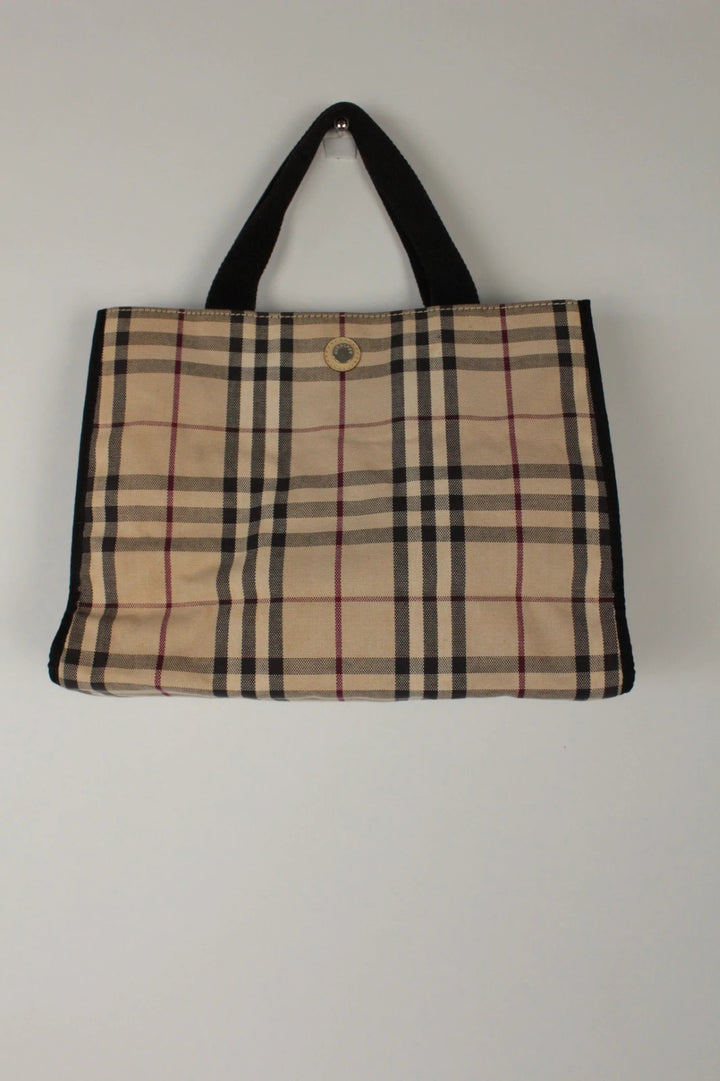 Burberry beige Nova Check tote bag with black trim and gold embossed logo plate.