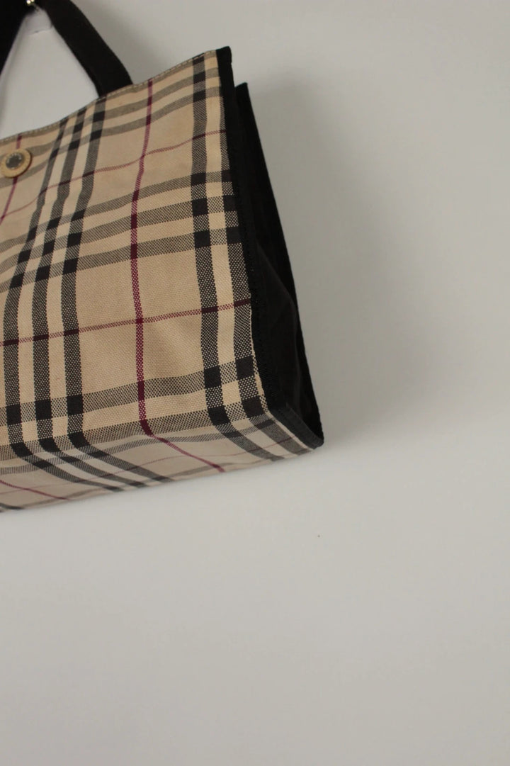Burberry beige Nova Check tote bag with black trim and gold embossed logo plate.