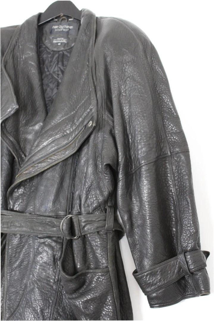 Marc Buchanan black leather belted trench coat with textured grain and deep lapels.