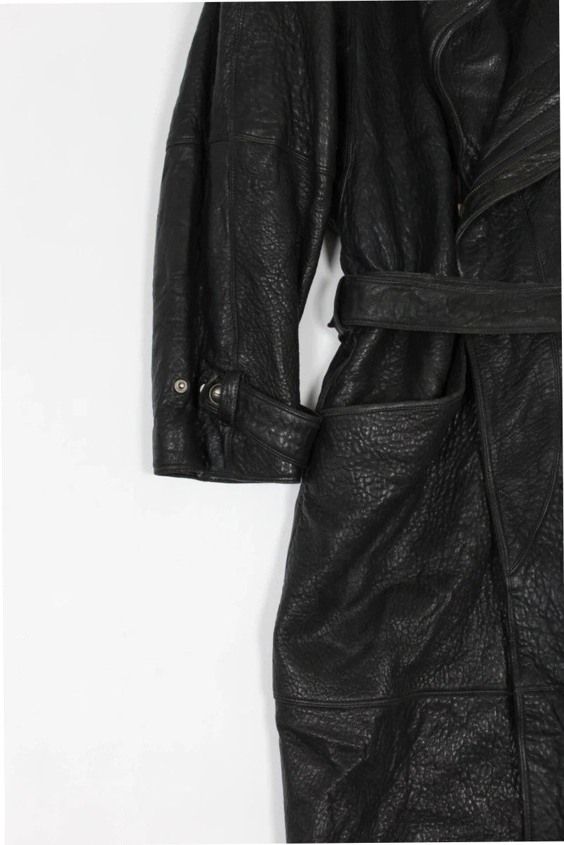 Marc Buchanan black leather belted trench coat with textured grain and deep lapels.