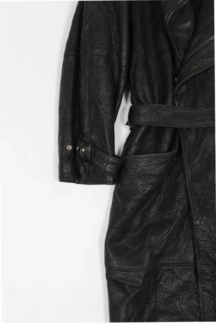 Marc Buchanan black leather belted trench coat with textured grain and deep lapels.