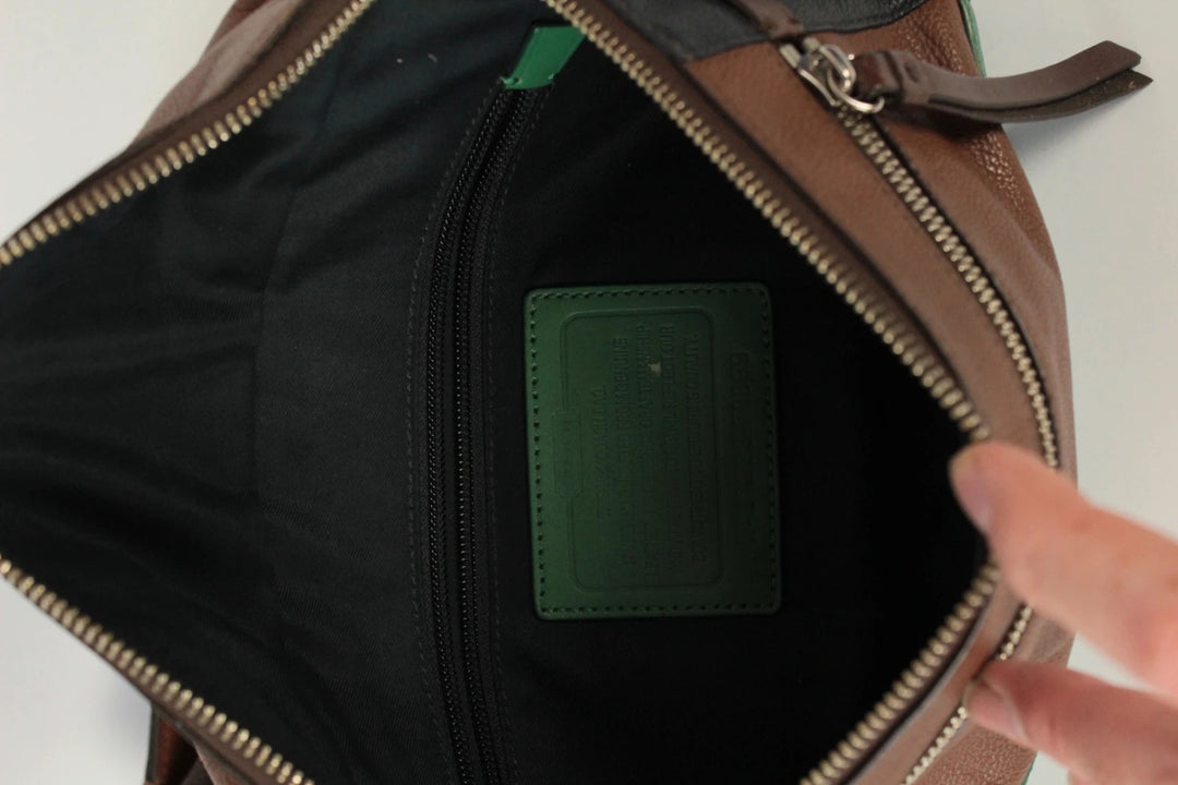 Coach fanny pack black brown emerald green colorblock design with premium pebble leather.