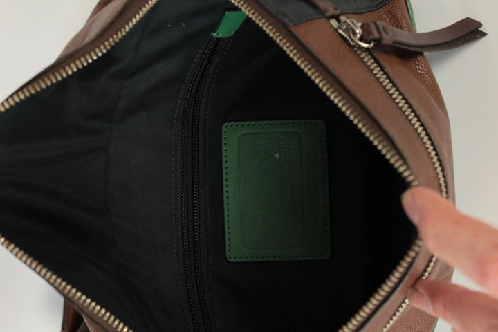 Coach fanny pack black brown emerald green colorblock design with premium pebble leather.