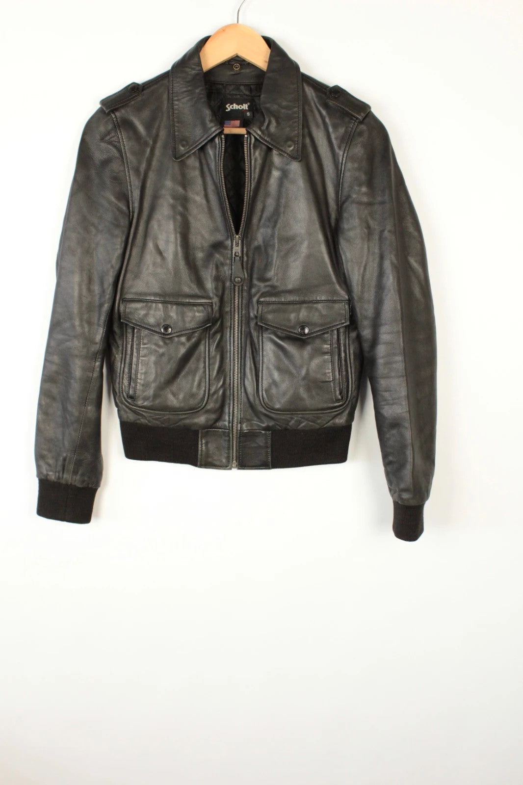Schott black leather flight bomber jacket with ribbed cuffs and smooth front zip.