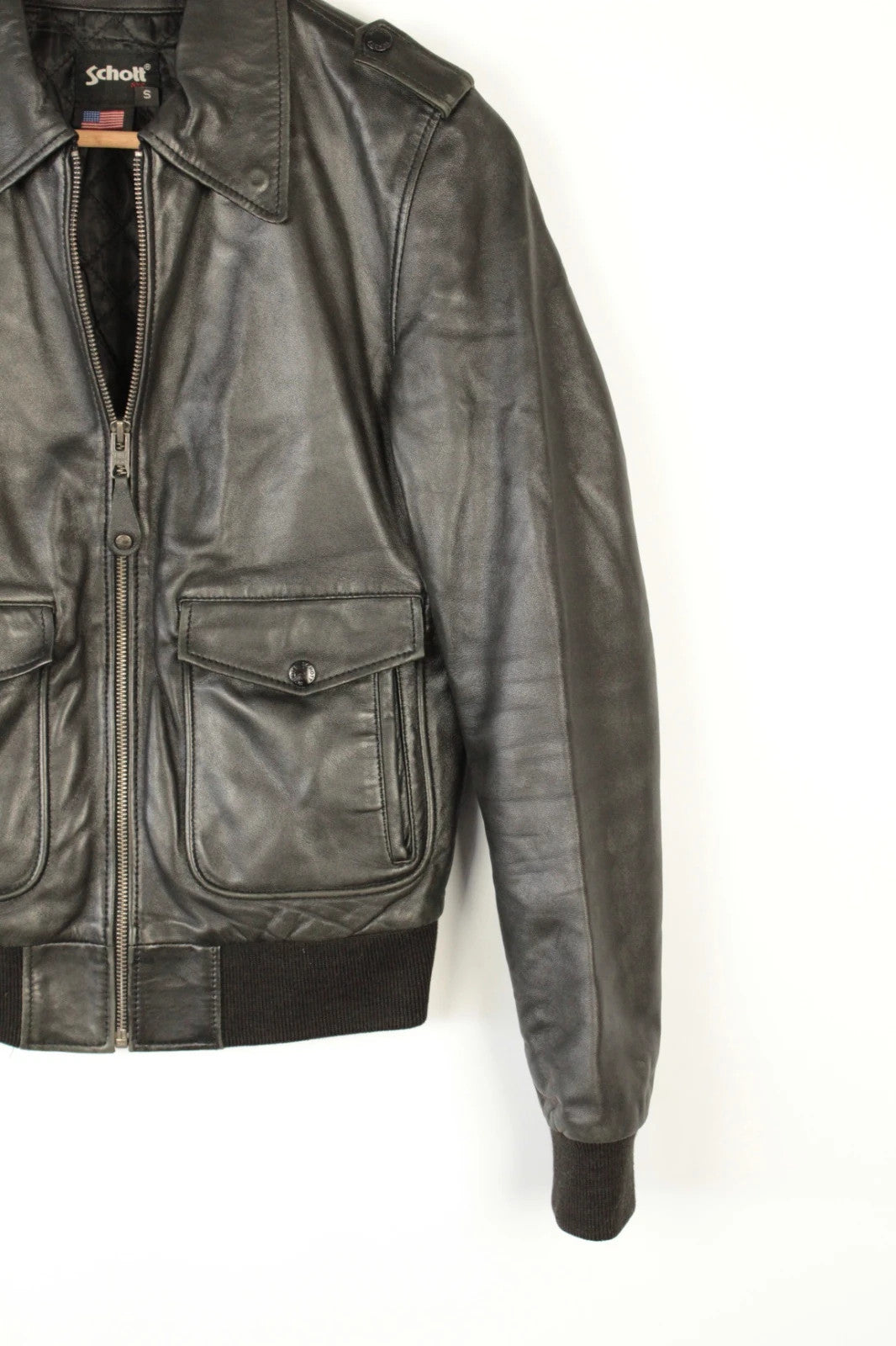 Schott black leather flight bomber jacket with ribbed cuffs and smooth front zip.