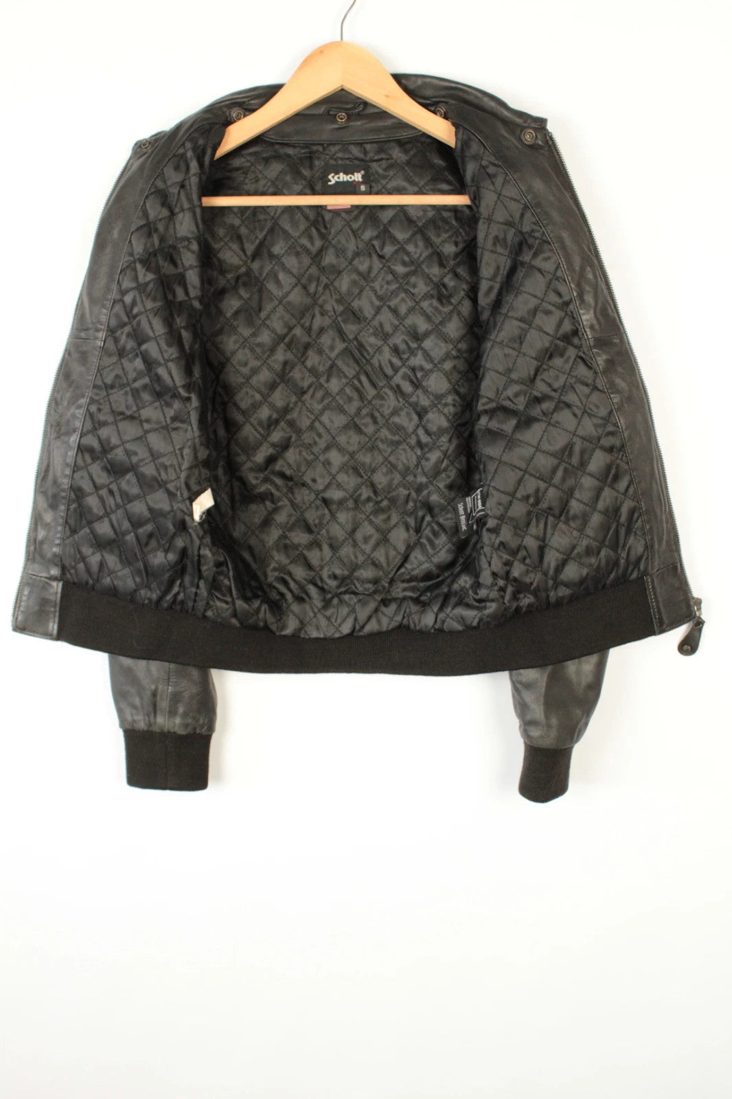 Schott black leather flight bomber jacket with ribbed cuffs and smooth front zip.