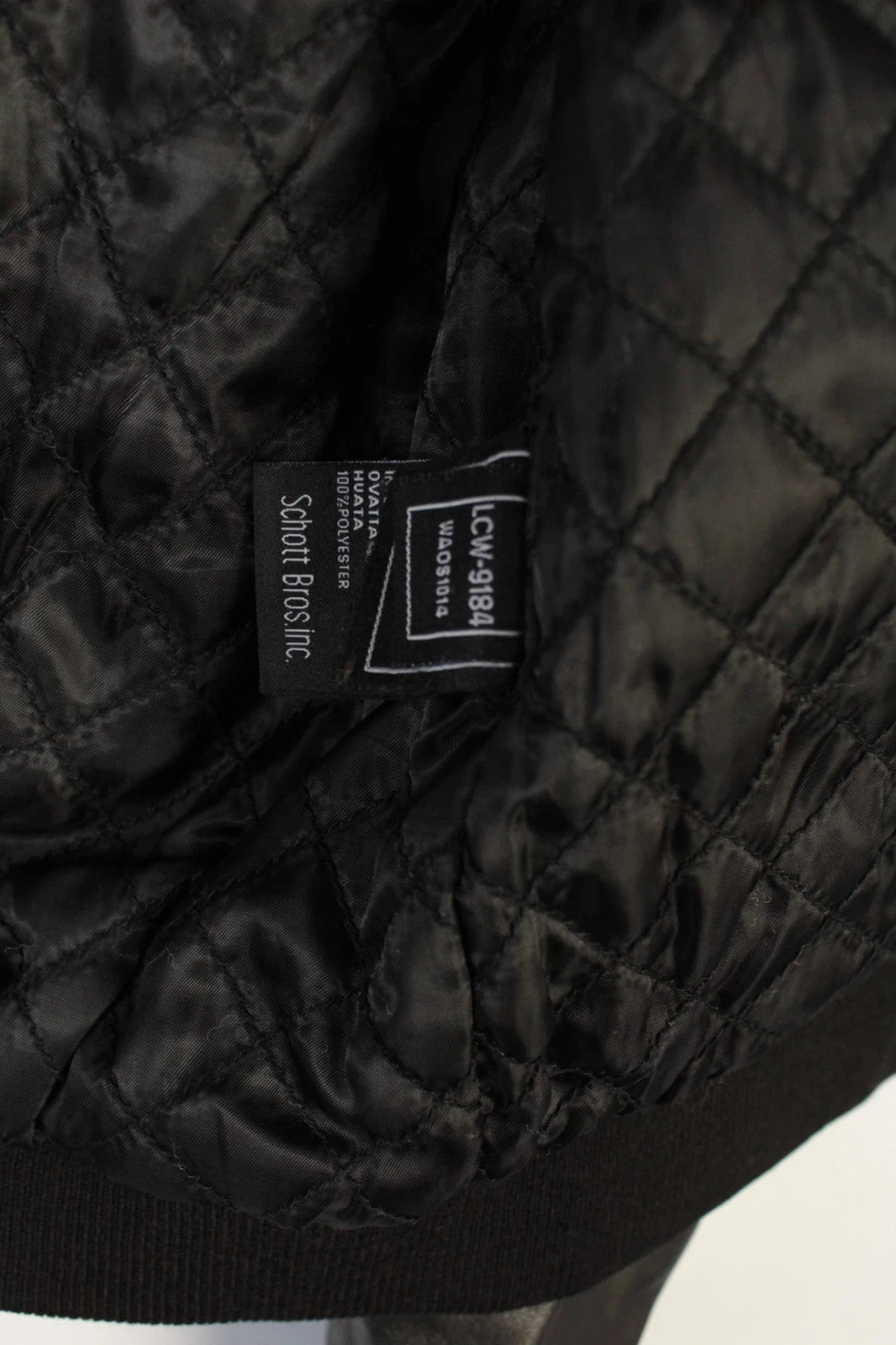 Schott black leather flight bomber jacket with ribbed cuffs and smooth front zip.