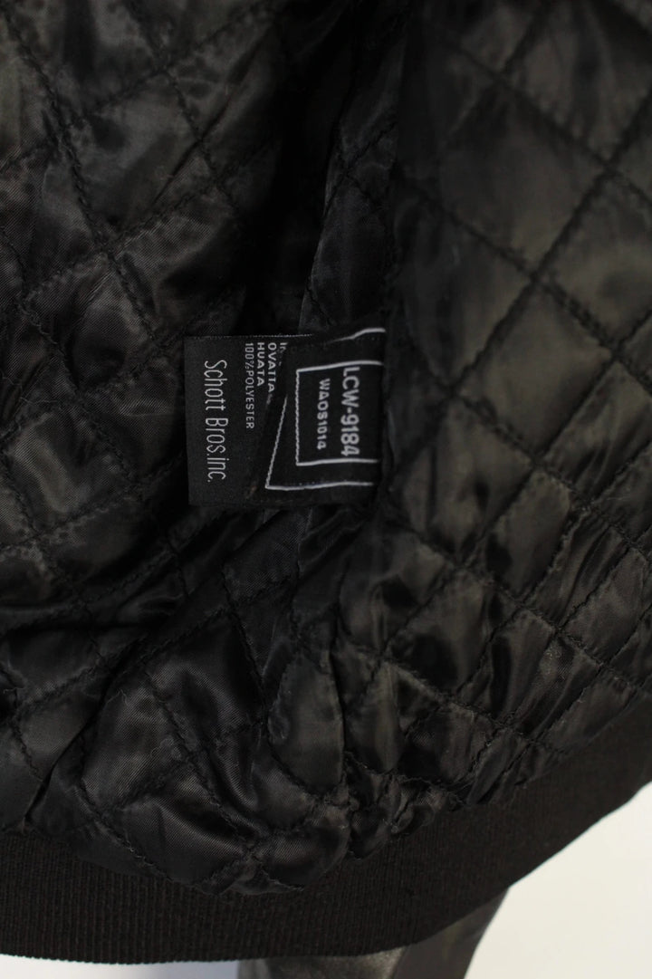 Schott black leather flight bomber jacket with ribbed cuffs and smooth front zip.