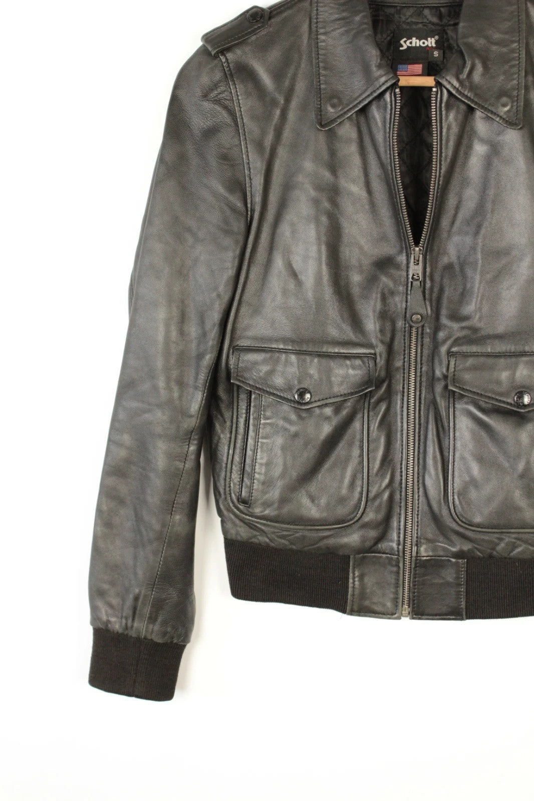 Schott black leather flight bomber jacket with ribbed cuffs and smooth front zip.