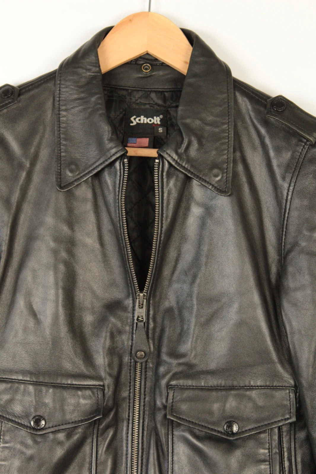 Schott black leather flight bomber jacket with ribbed cuffs and smooth front zip.