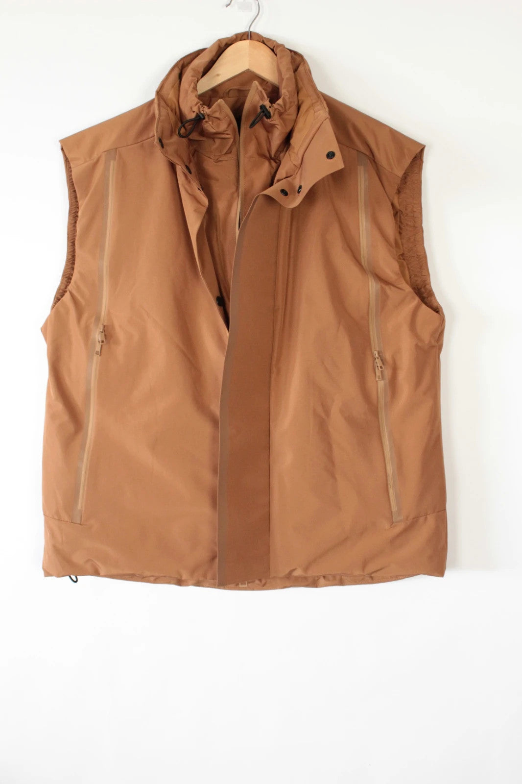 3.1 Phillip Lim brown puffer gilet vest with high-neck toggles and waterproof side-zip pockets.