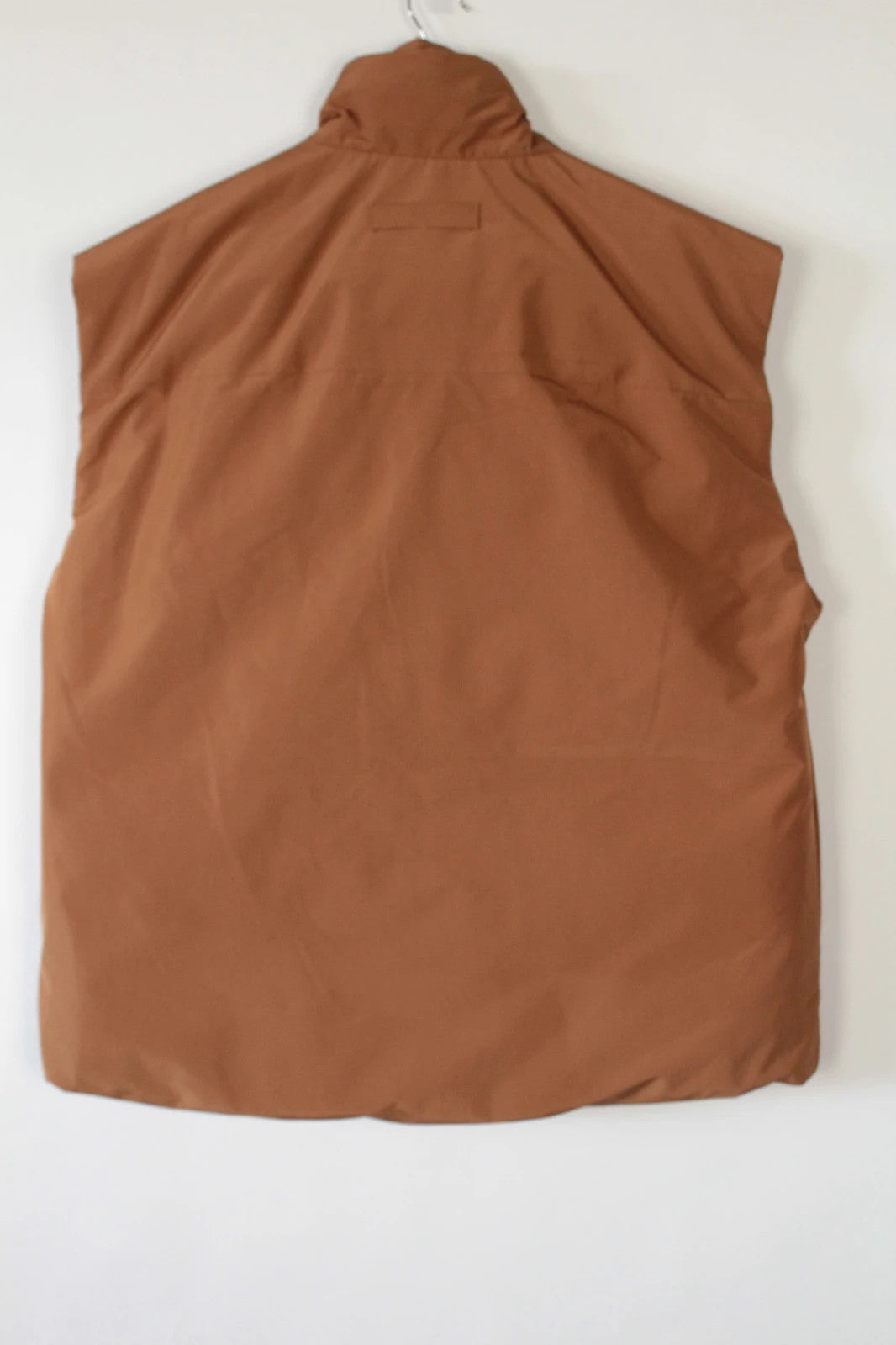 3.1 Phillip Lim brown puffer gilet vest with high-neck toggles and waterproof side-zip pockets.