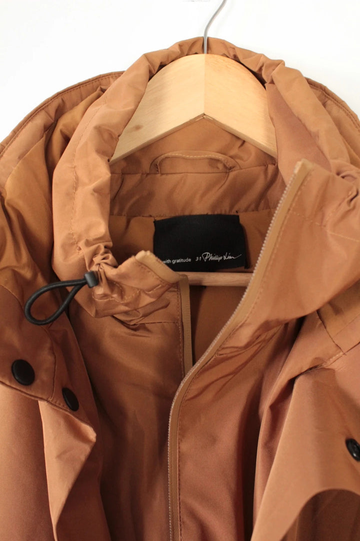 3.1 Phillip Lim brown puffer gilet vest with high-neck toggles and waterproof side-zip pockets.
