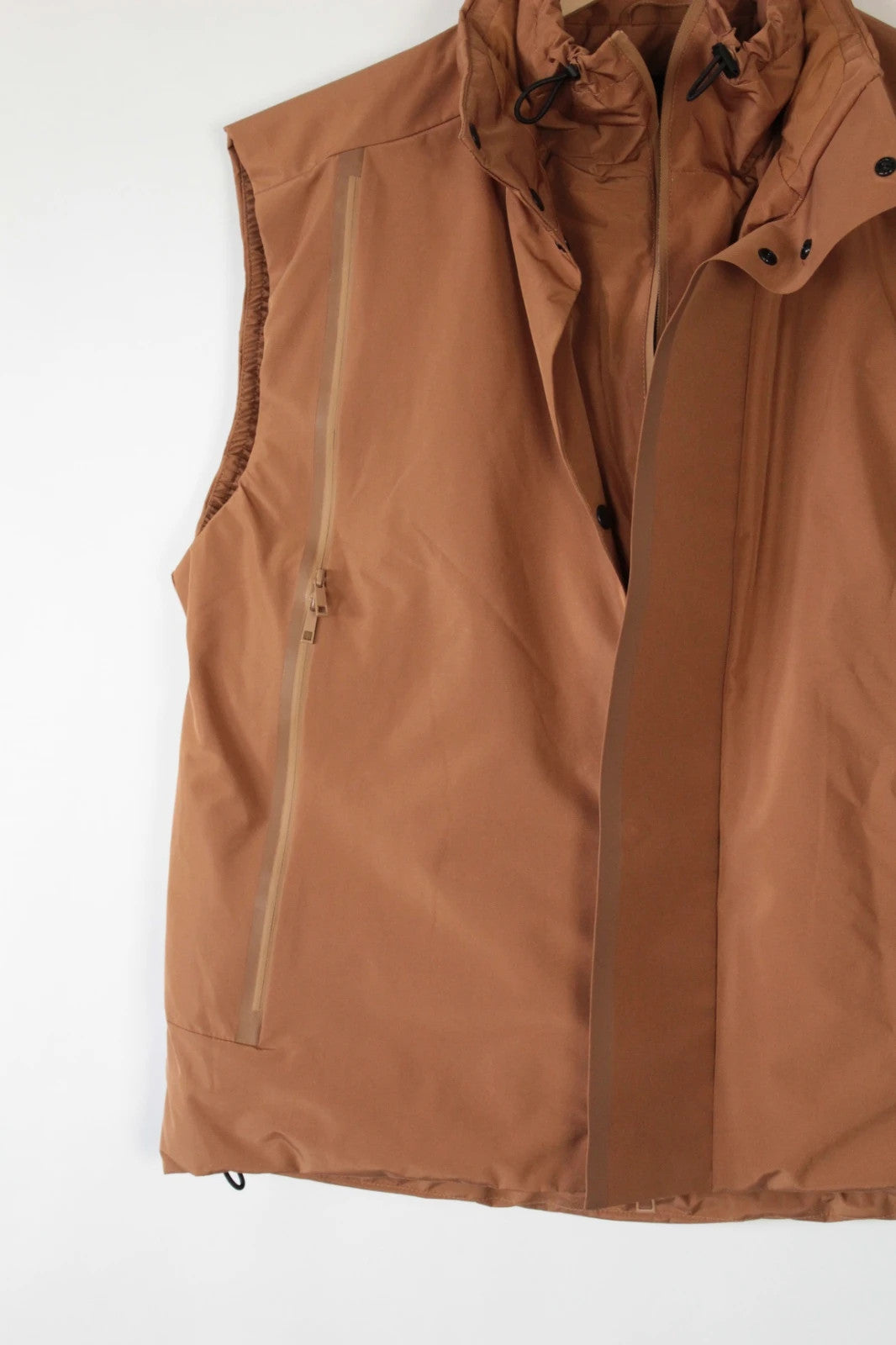 3.1 Phillip Lim brown puffer gilet vest with high-neck toggles and waterproof side-zip pockets.