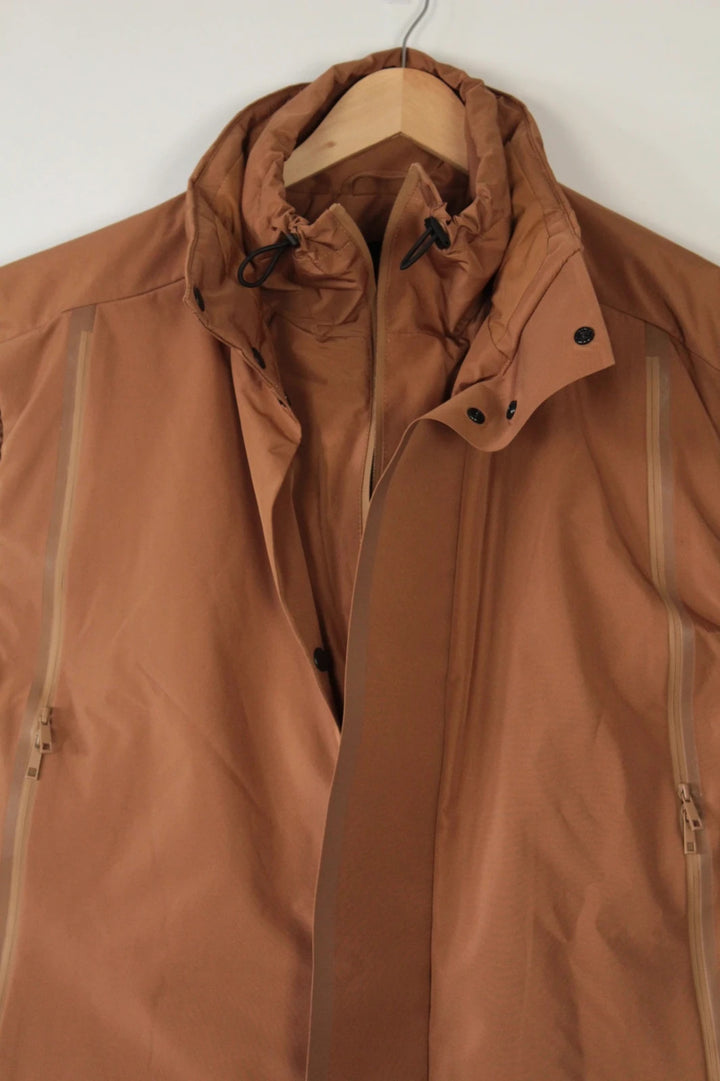 3.1 Phillip Lim brown puffer gilet vest with high-neck toggles and waterproof side-zip pockets.