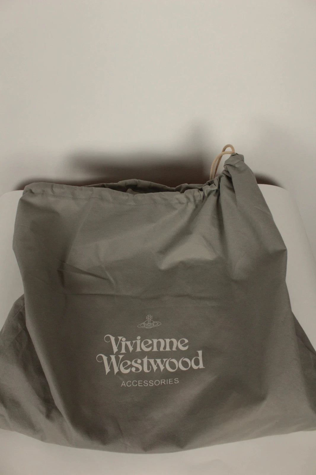 Vivienne Westwood multi checkered handbag with iconic Orb logo and leather accents.