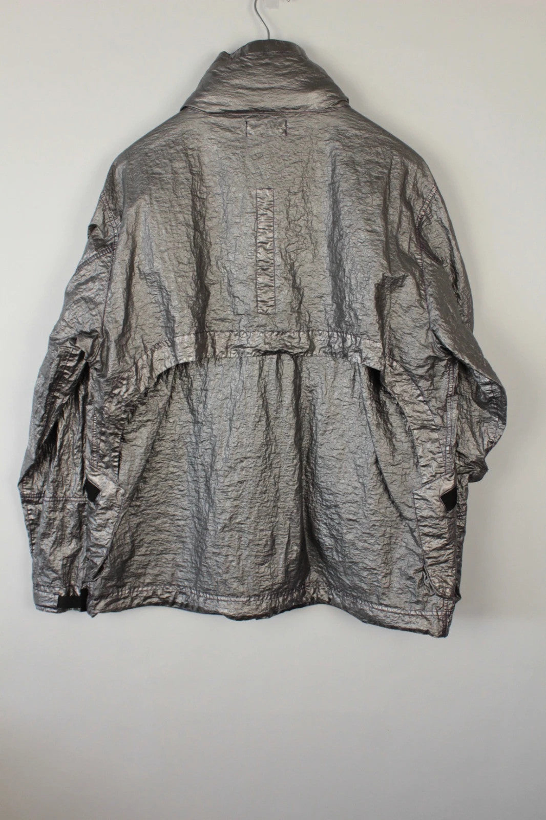 Stone Island purple and silver jacket with iridescent crinkle metal shell and logo.
