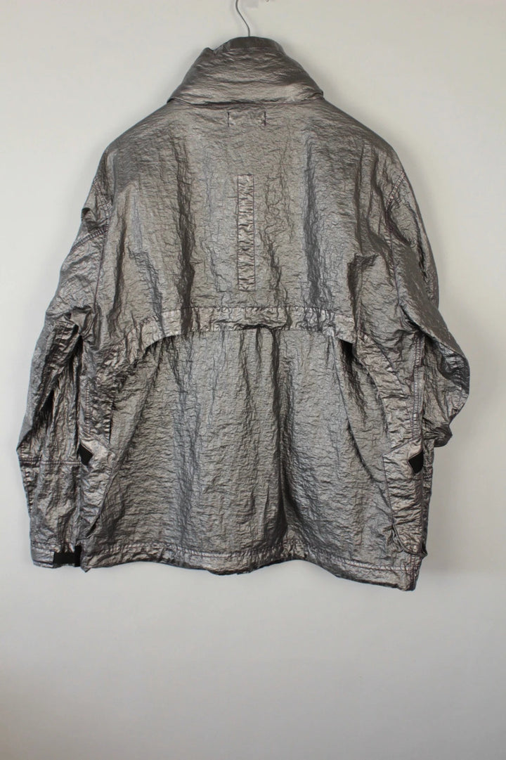 Stone Island purple and silver jacket with iridescent crinkle metal shell and logo.