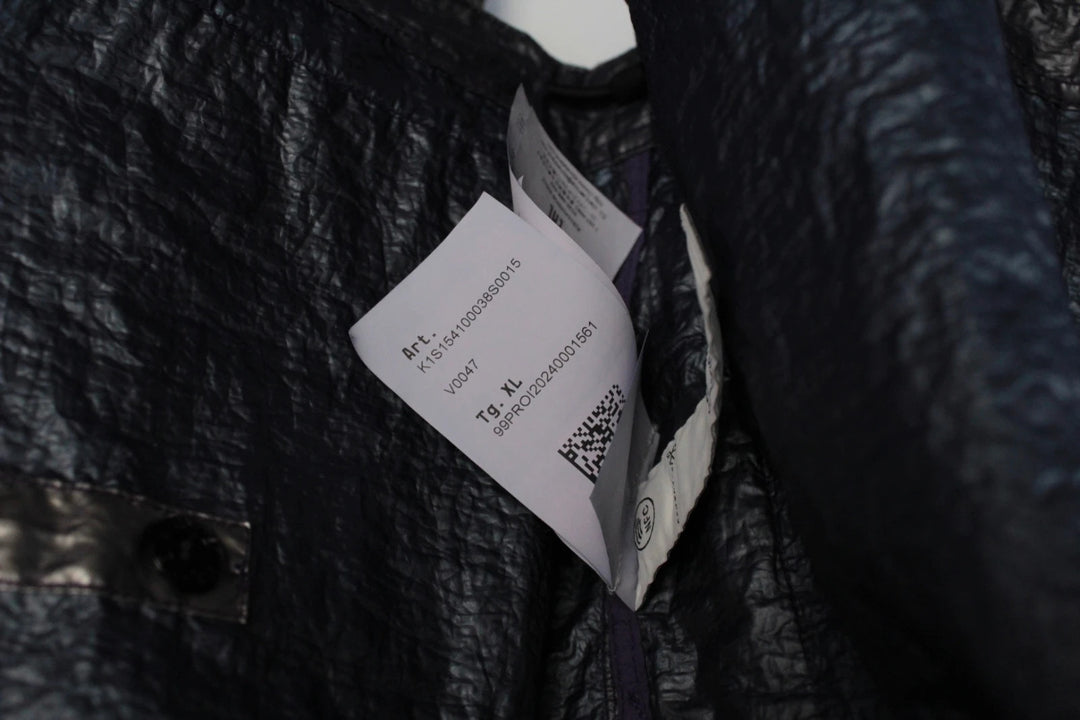 Stone Island purple and silver jacket with iridescent crinkle metal shell and logo.