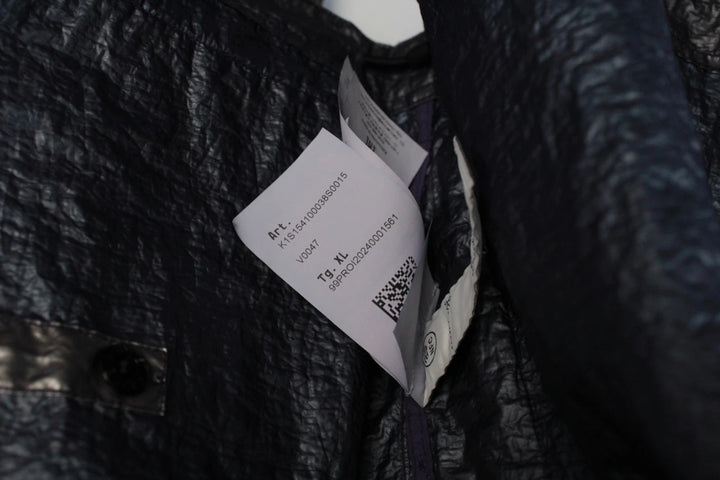 Stone Island purple and silver jacket with iridescent crinkle metal shell and logo.