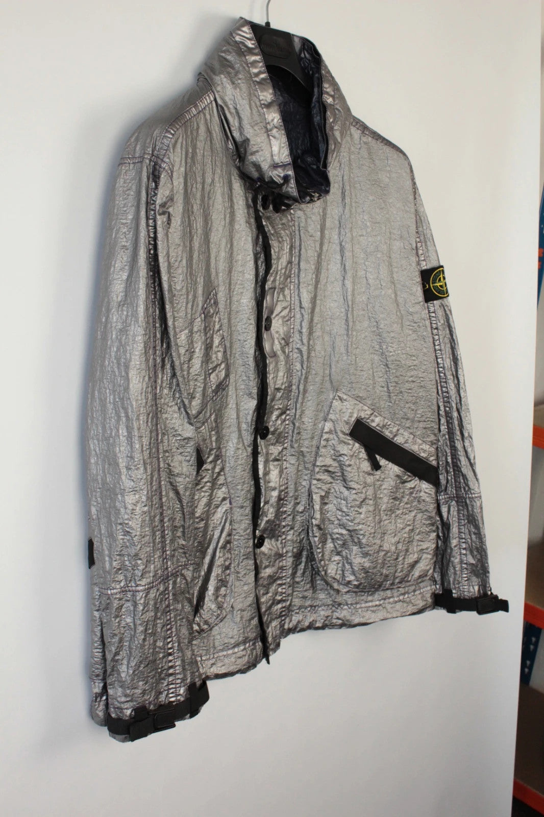 Stone Island purple and silver jacket with iridescent crinkle metal shell and logo.