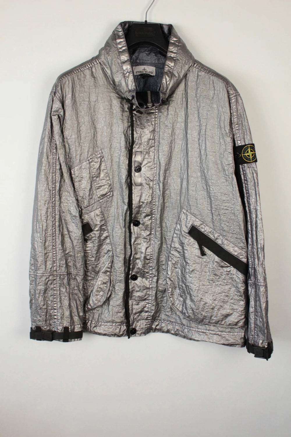 Stone Island purple and silver jacket with iridescent crinkle metal shell and logo.