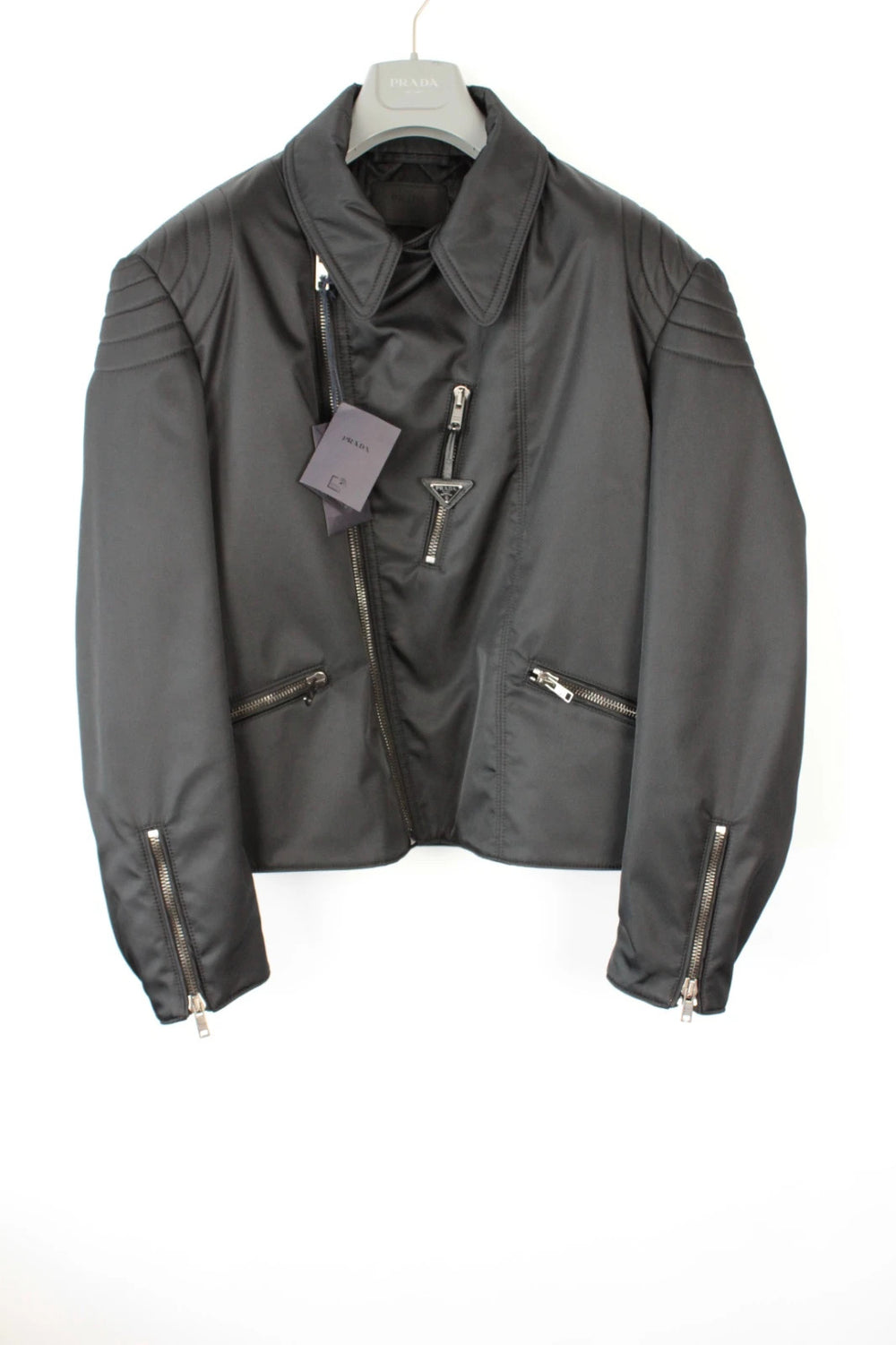 Prada black Re-Nylon biker jacket with enamel triangle logo and asymmetric front zip.