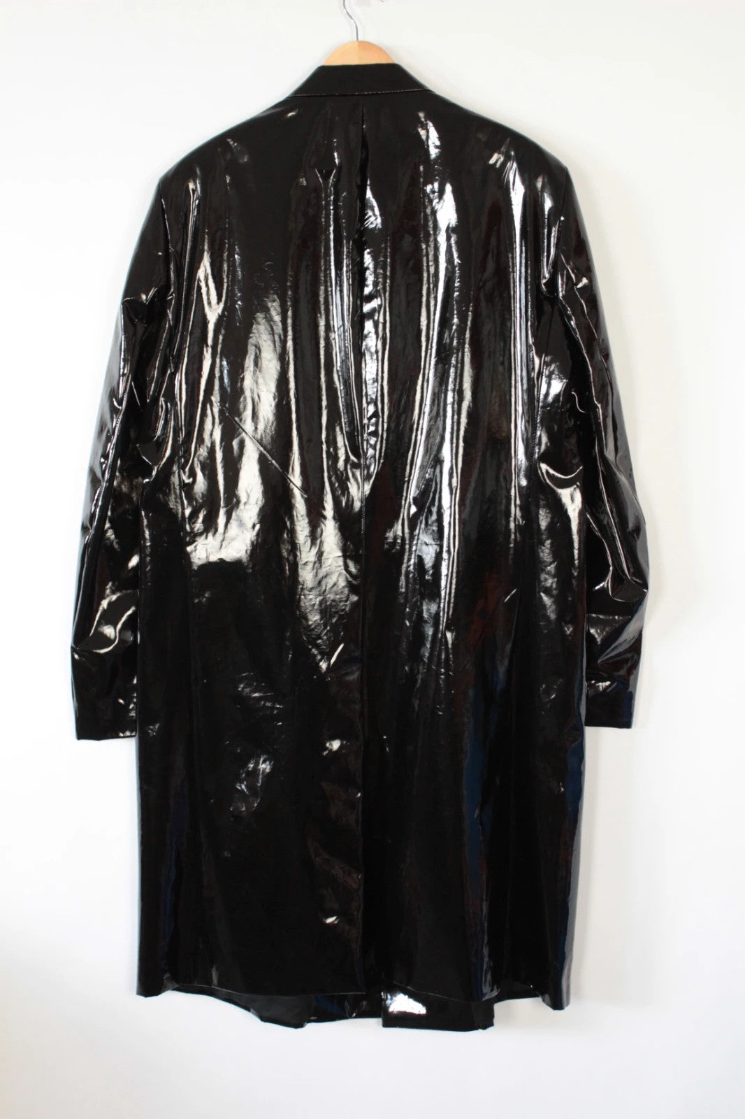 Raf Simons black double-breasted trench coat glossy PVC finish with notched lapels.