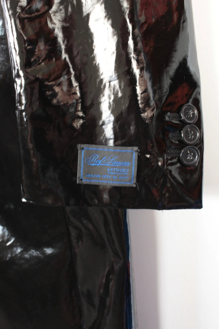 Raf Simons black double-breasted trench coat glossy PVC finish with notched lapels.