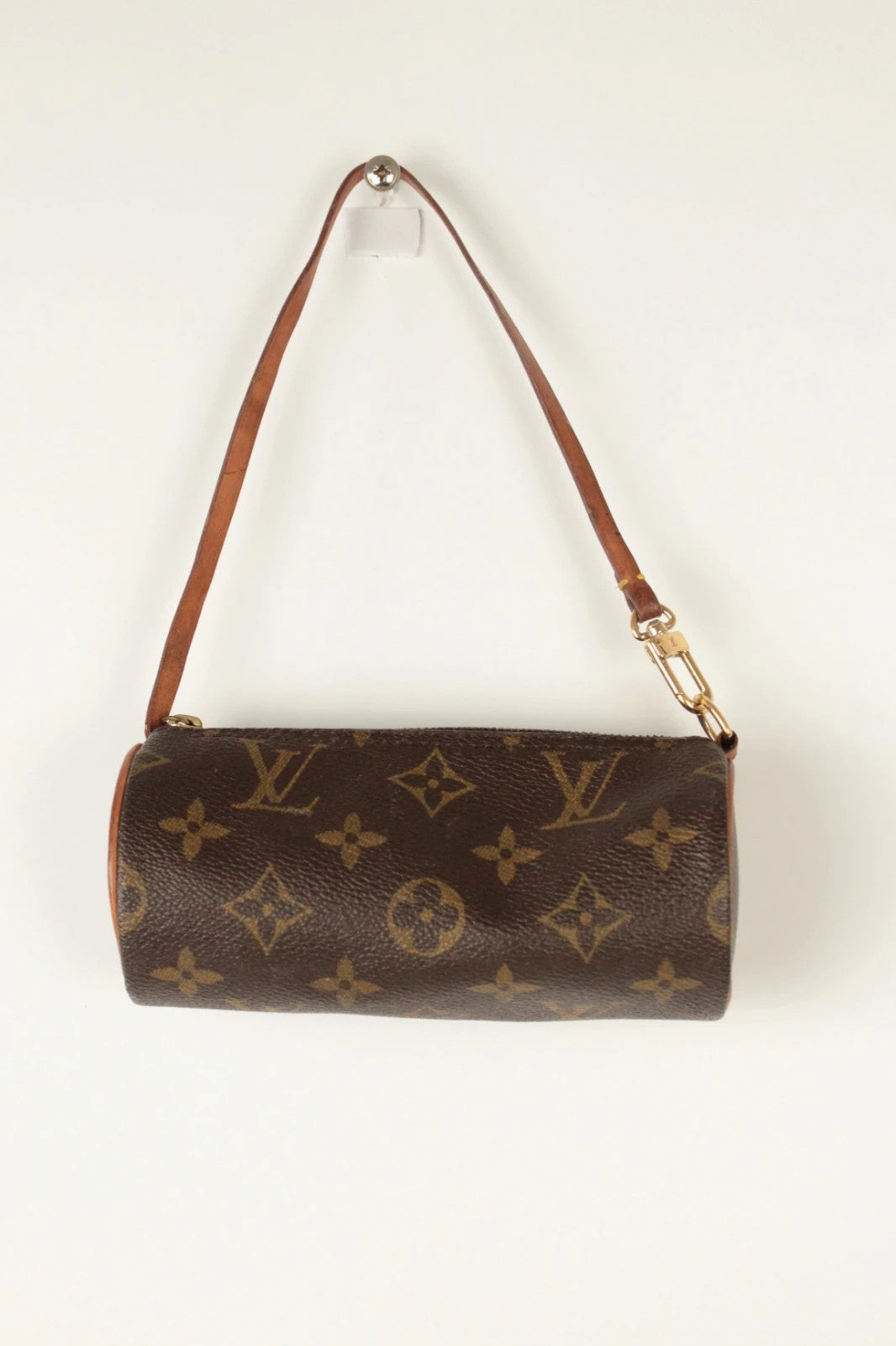 Louis Vuitton black and brown monogram micro mini pouch bag with vachetta leather trim.