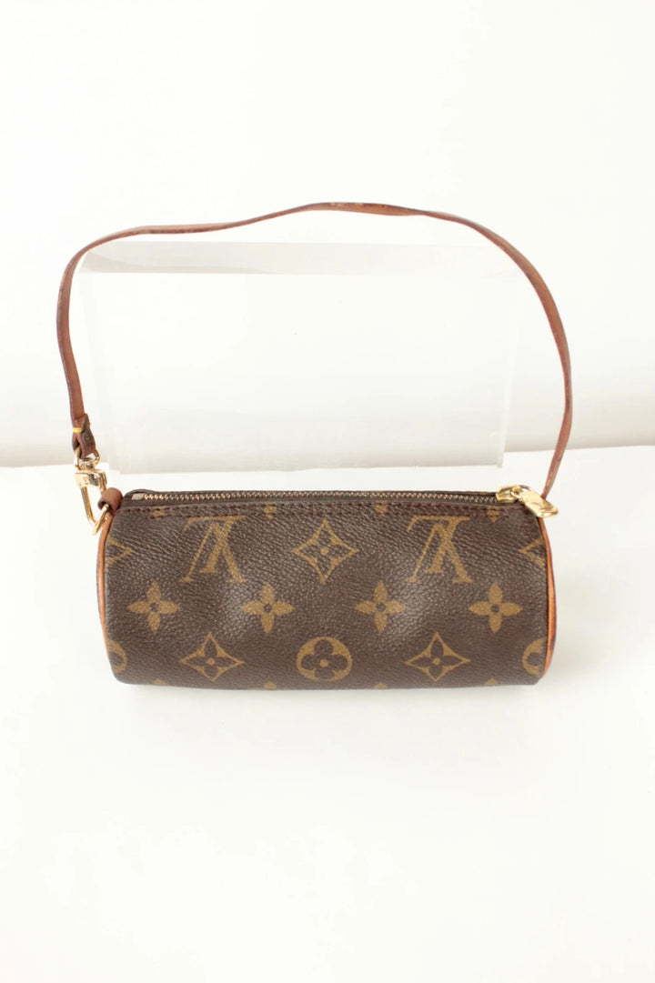 Louis Vuitton black and brown monogram micro mini pouch bag with vachetta leather trim.