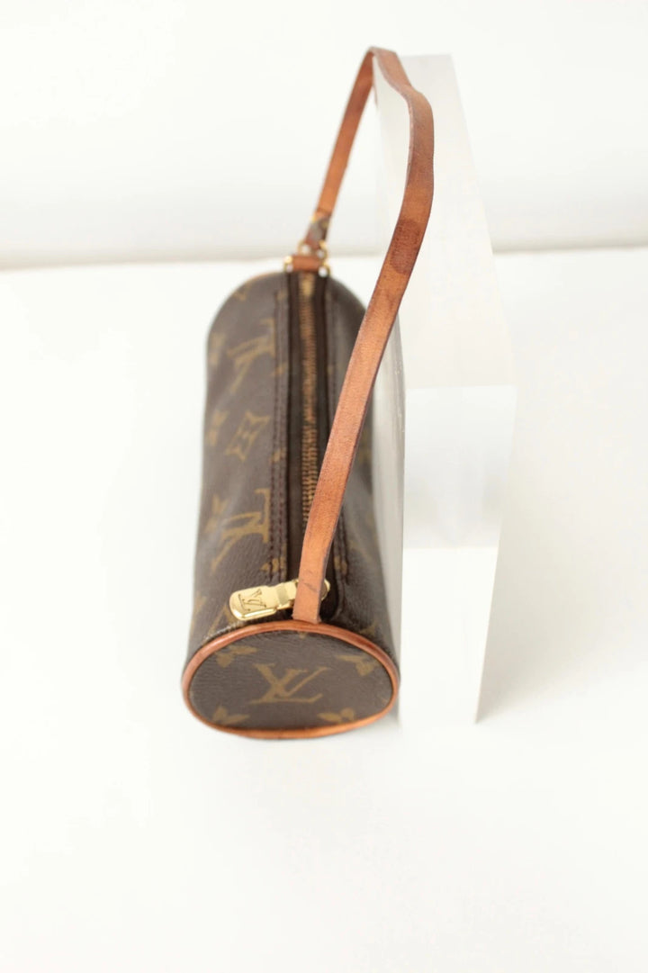 Louis Vuitton black and brown monogram micro mini pouch bag with vachetta leather trim.