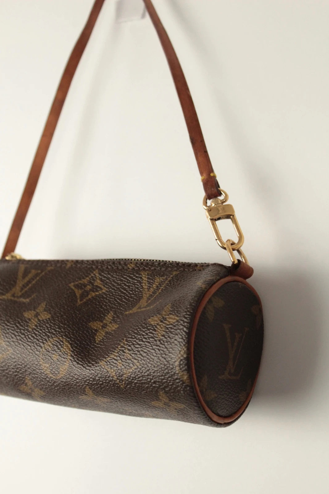Louis Vuitton black and brown monogram micro mini pouch bag with vachetta leather trim.