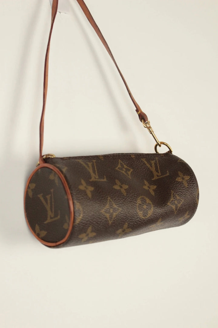 Louis Vuitton black and brown monogram micro mini pouch bag with vachetta leather trim.