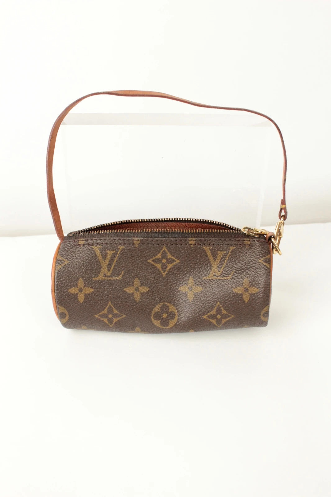 Louis Vuitton black and brown monogram micro mini pouch bag with vachetta leather trim.