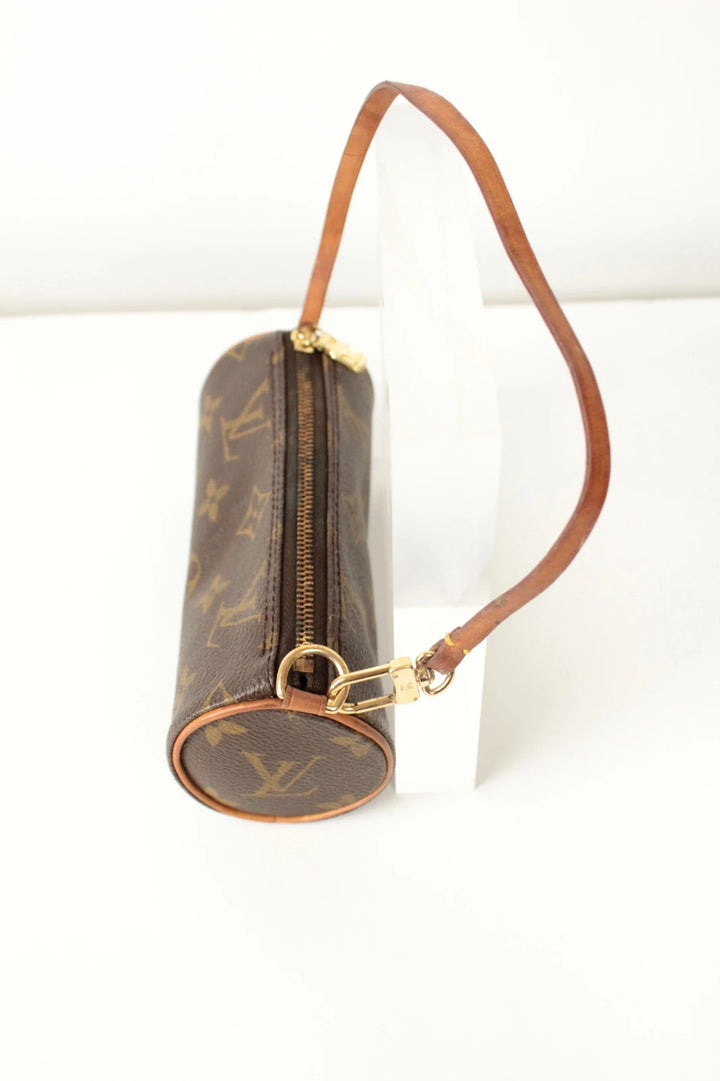 Louis Vuitton black and brown monogram micro mini pouch bag with vachetta leather trim.