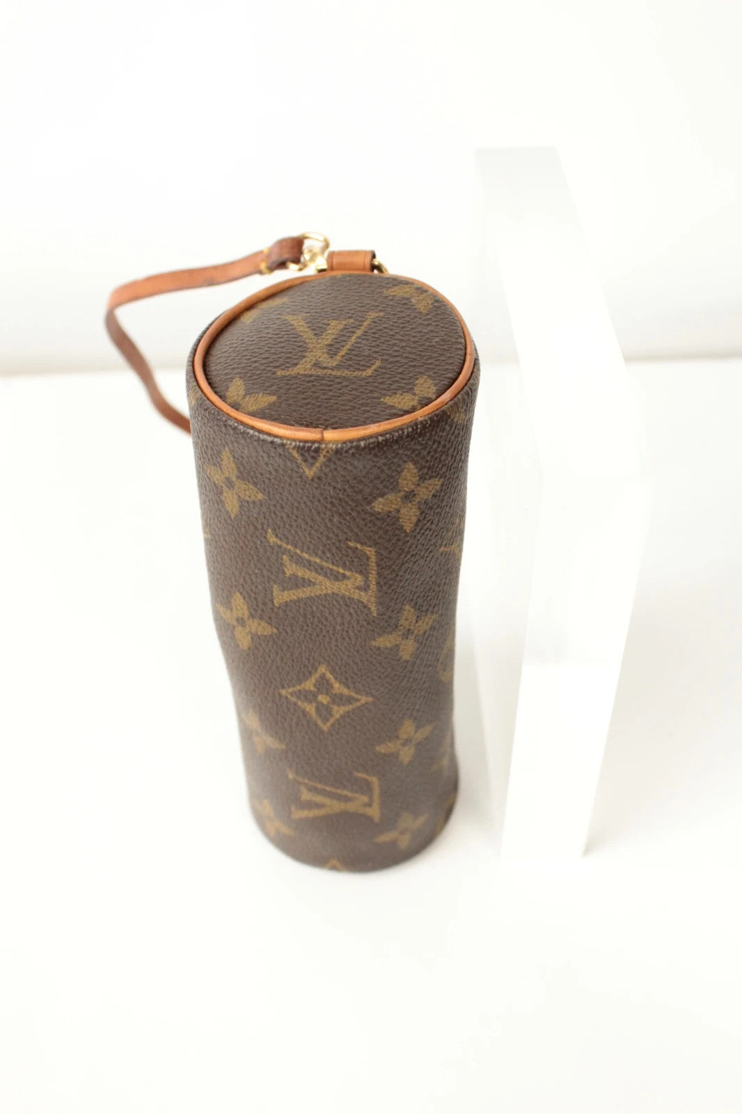 Louis Vuitton black and brown monogram micro mini pouch bag with vachetta leather trim.