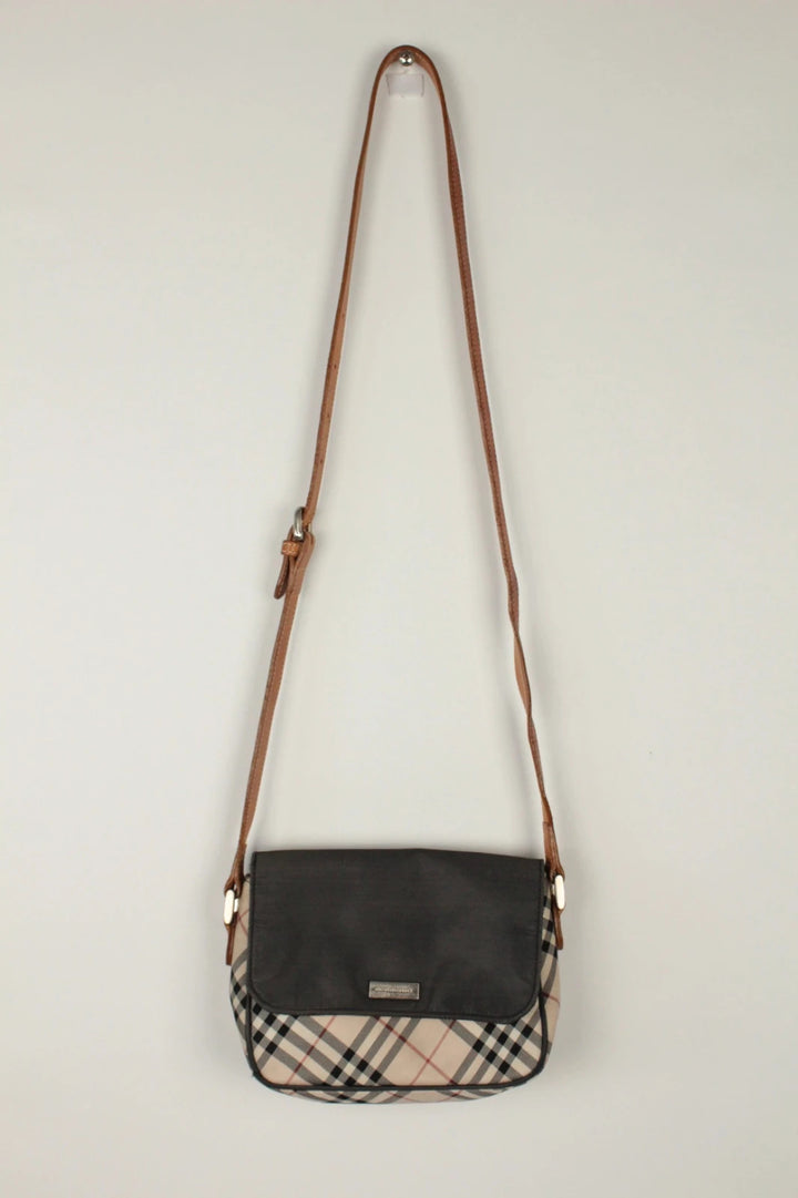 Burberry beige Nova Check crossbody handbag with black nylon flap and leather strap.