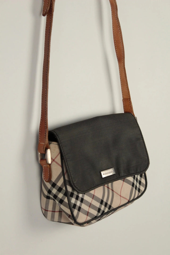 Burberry beige Nova Check crossbody handbag with black nylon flap and leather strap.