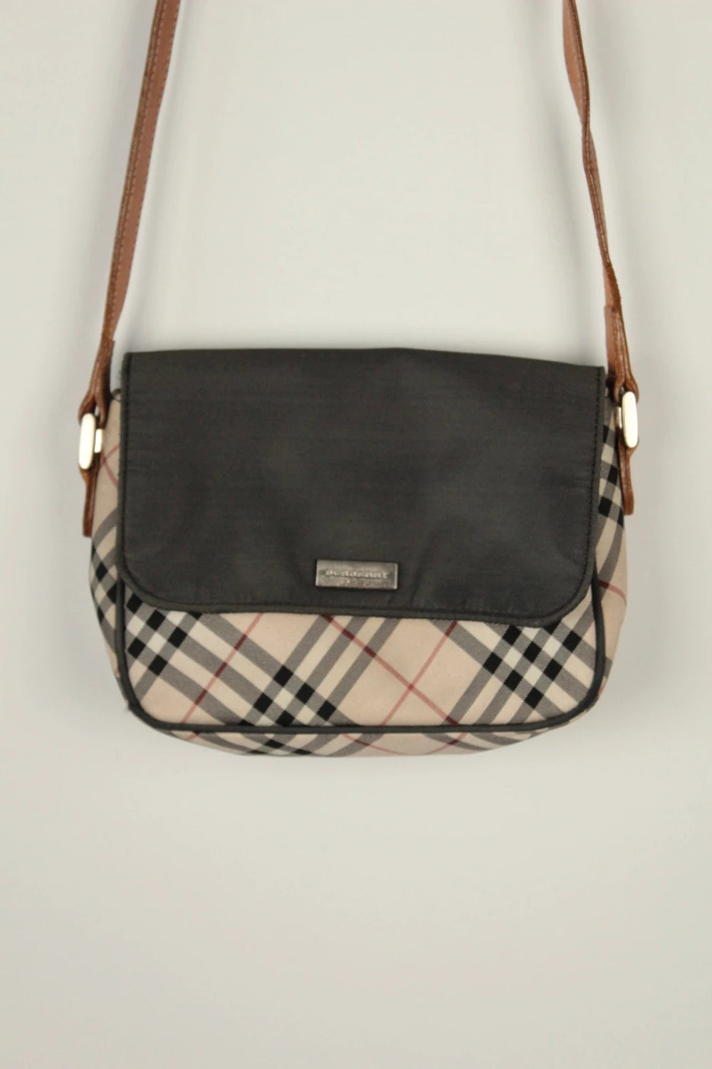 Burberry beige Nova Check crossbody handbag with black nylon flap and leather strap.
