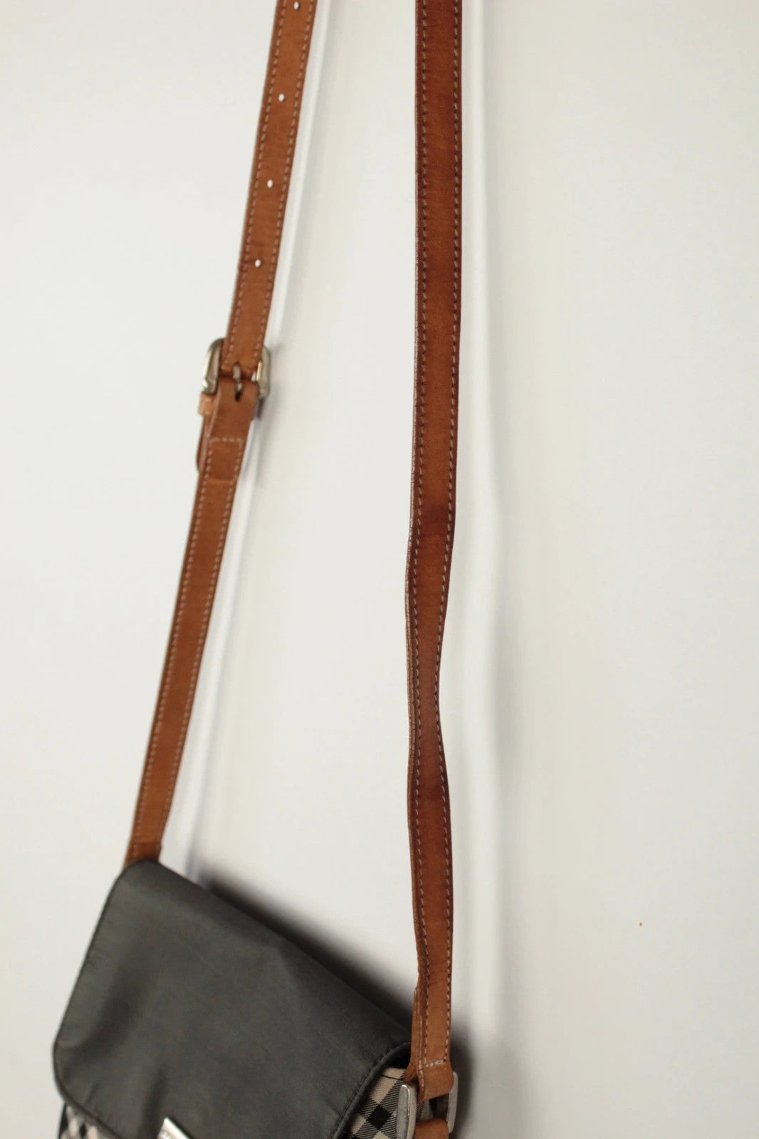 Burberry beige Nova Check crossbody handbag with black nylon flap and leather strap.
