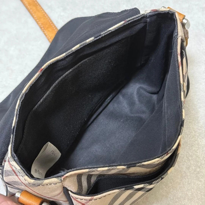 Burberry beige Nova Check crossbody handbag with black nylon flap and leather strap.